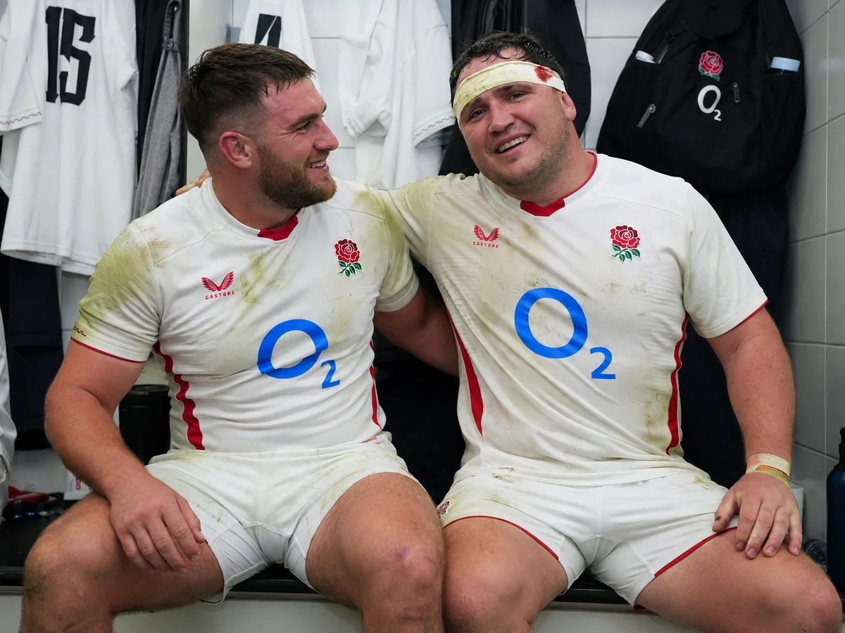 England players celebrate in the dressing room